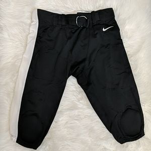 NWOT Nike football pants. Knee length. Size large